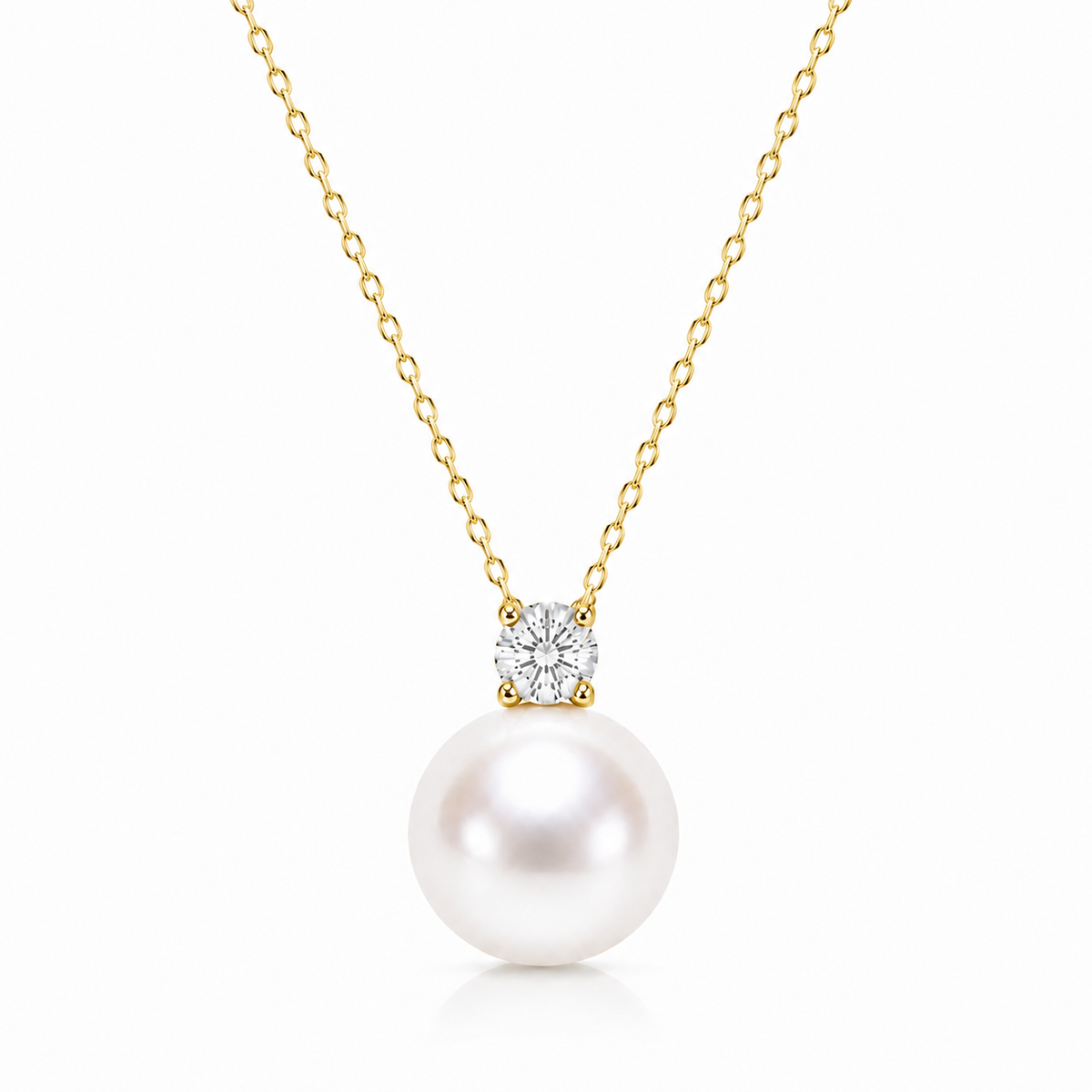Gold-tone colour reference of a freshwater pearl solitaire necklace with a clear cubic zirconia on a white background.