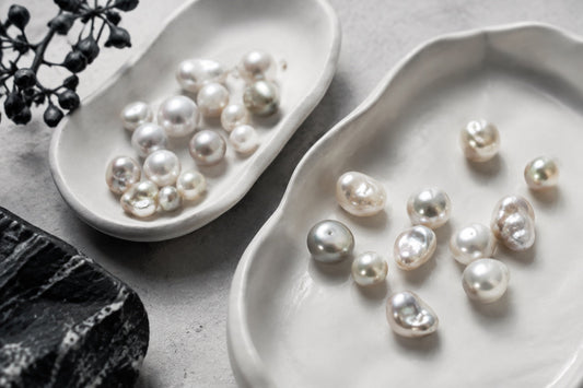 Different pearl shapes arranged in a ceramic tray
