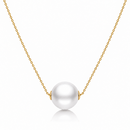 Gold freshwater pearl bead necklace with a single round white pearl on a white background