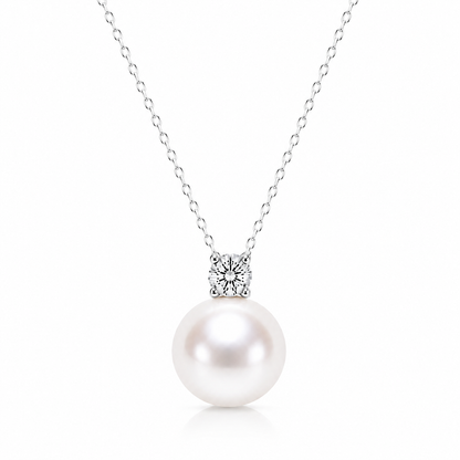 Freshwater pearl solitaire necklace with a four-prong cubic zirconia and silver-tone chain on a white background.