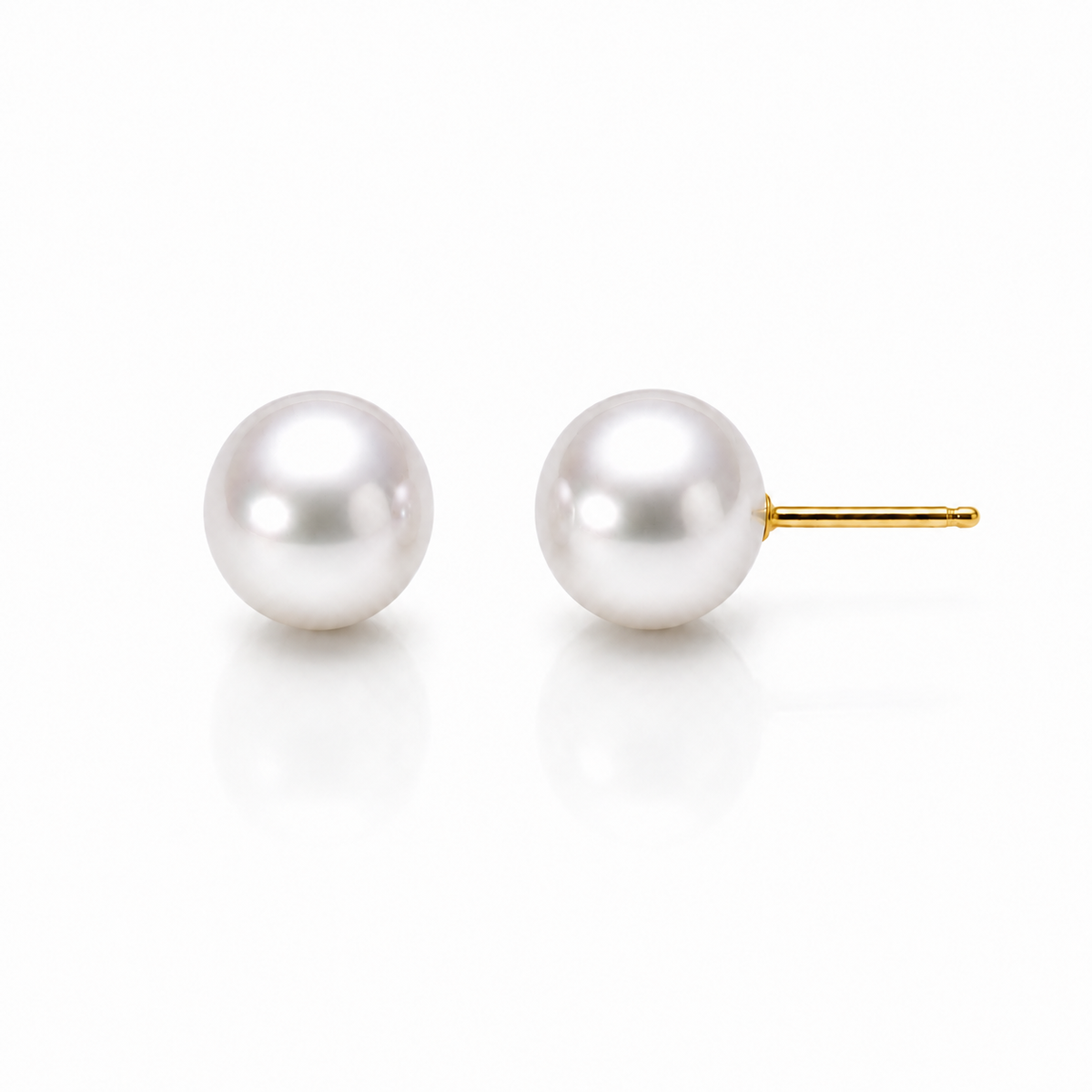 Freshwater pearl stud earrings with yellow gold posts on a white background