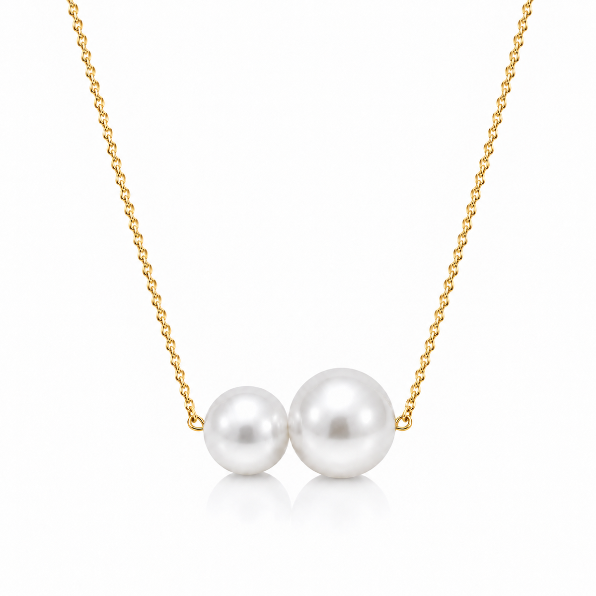 Freshwater pearl duo necklace with a gold-tone sterling silver chain on a white background