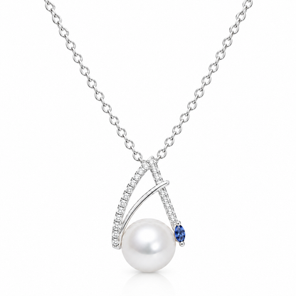 Sea Wish freshwater pearl pendant necklace in sterling silver with overlapping curves and cubic zirconia accents on a white background.